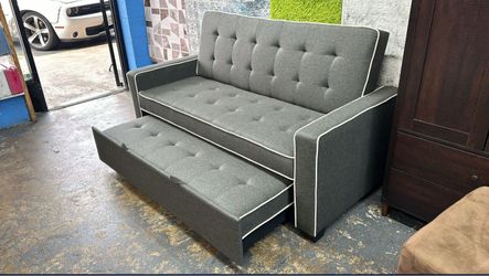 Gray Tufted Sofa with Pull-Out Trundle