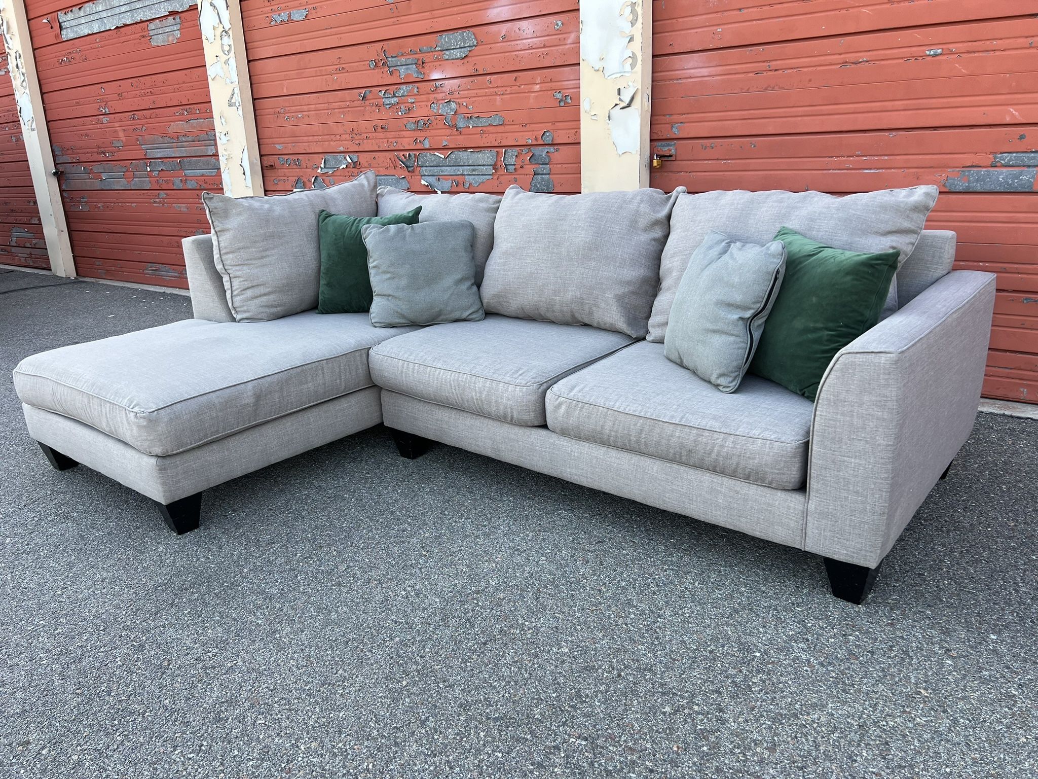 Gray sectional sofa couch with left facing chaise