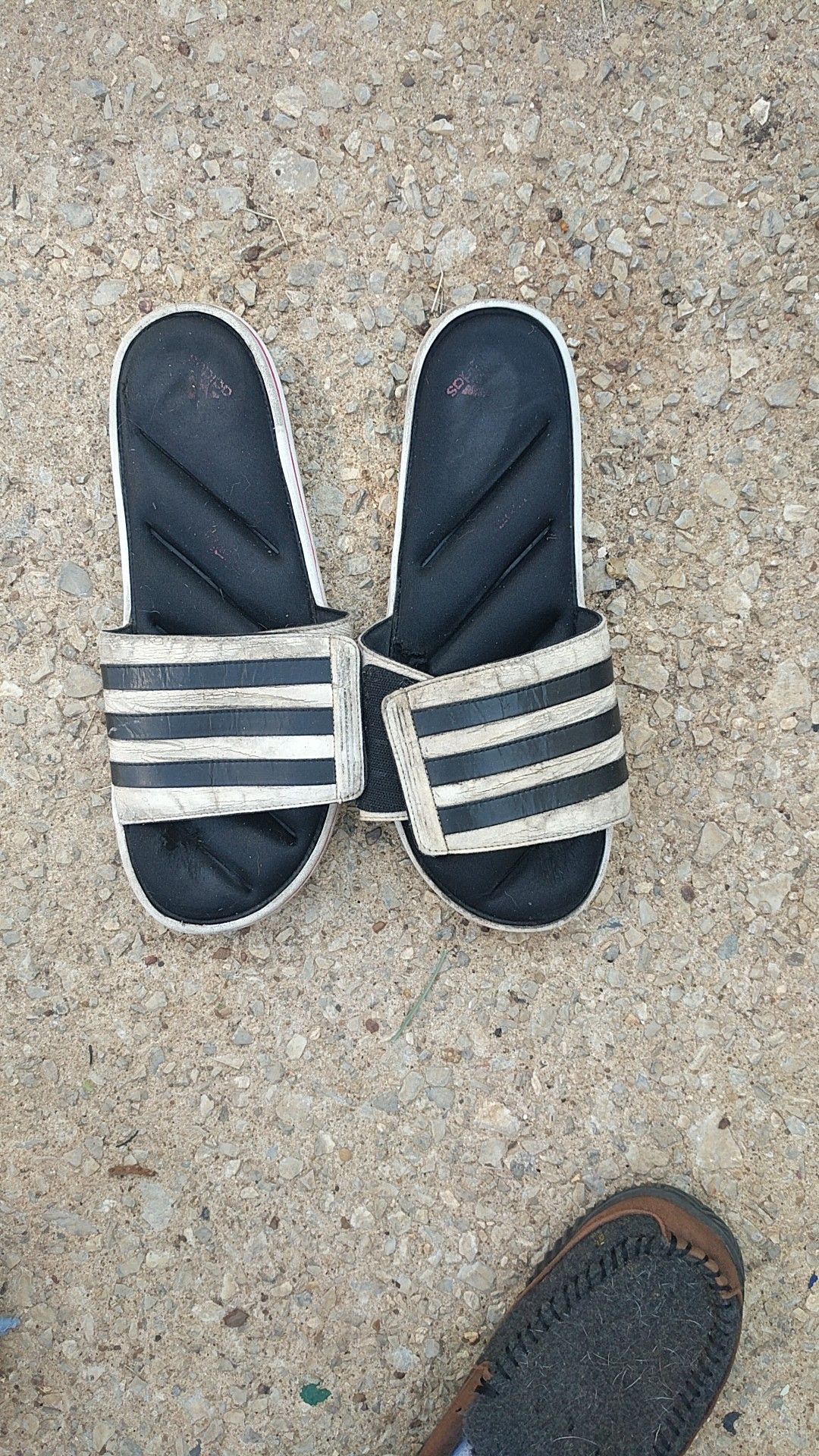 Beat up adidas sandals