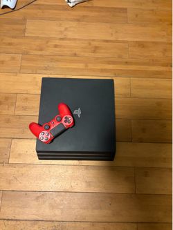 Sony PlayStation 4 Pro 1TB Console in Jet Black with red controller