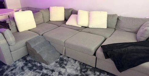 Modular gray sofa/bed with storage
