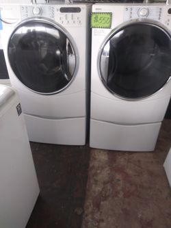 Kenmore front load washer and electric dryer set with pedestals in excellent conditions