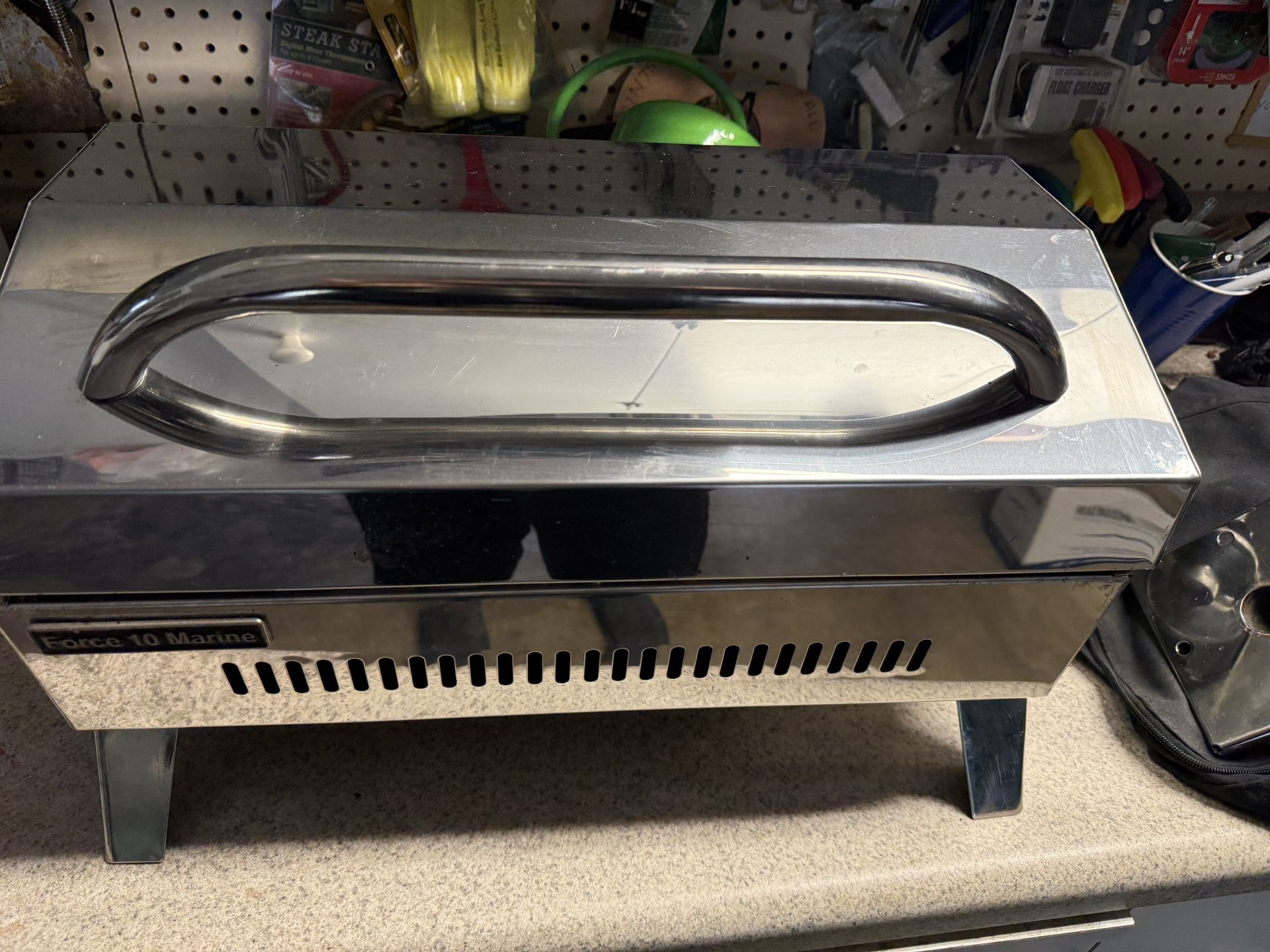 Marine Stainless Grill. Force 10. Good Condition. Lightly Used. Has Mount And Bag. Uses Smaller Coleman Style Propane Bottles. New Retails For $240+