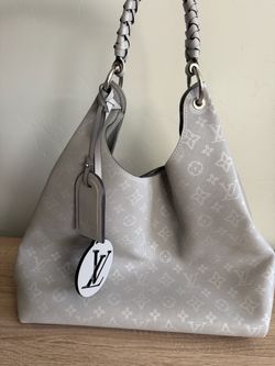 Louis Vuitton Mahina Leather Hobo Bag