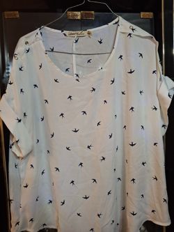 Beautiful White Blouse with pictures of birds flying. 