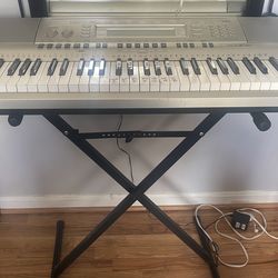 Piano , stand , and cable