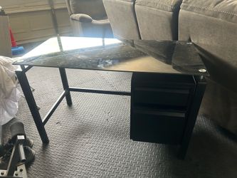 Steel desk with glass top. Bottoms drawer broken. $20 OBO