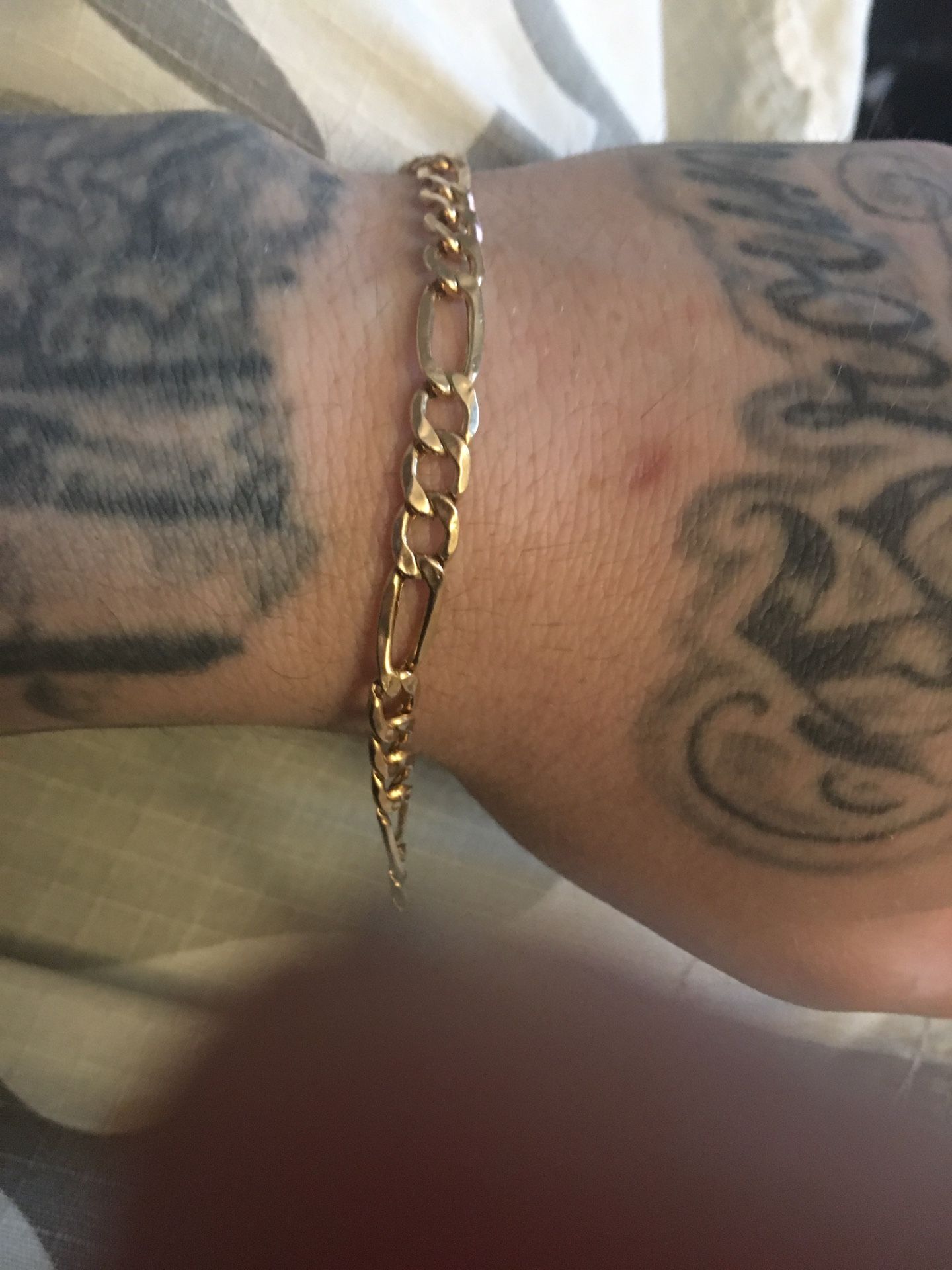 14 Kt solid gold figaro bracelet wieght is 8 grams