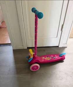 Little girl Barbie scooter