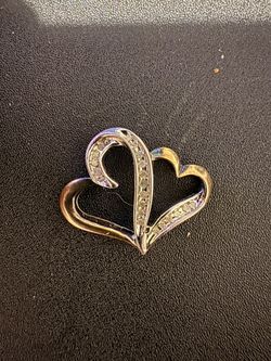 **SS925** refers to **sterling silver that is 92.5% pure silver**, And Gold. With Diamond Double Heart