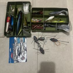 Two boxes full of fishing bait and several sinkers