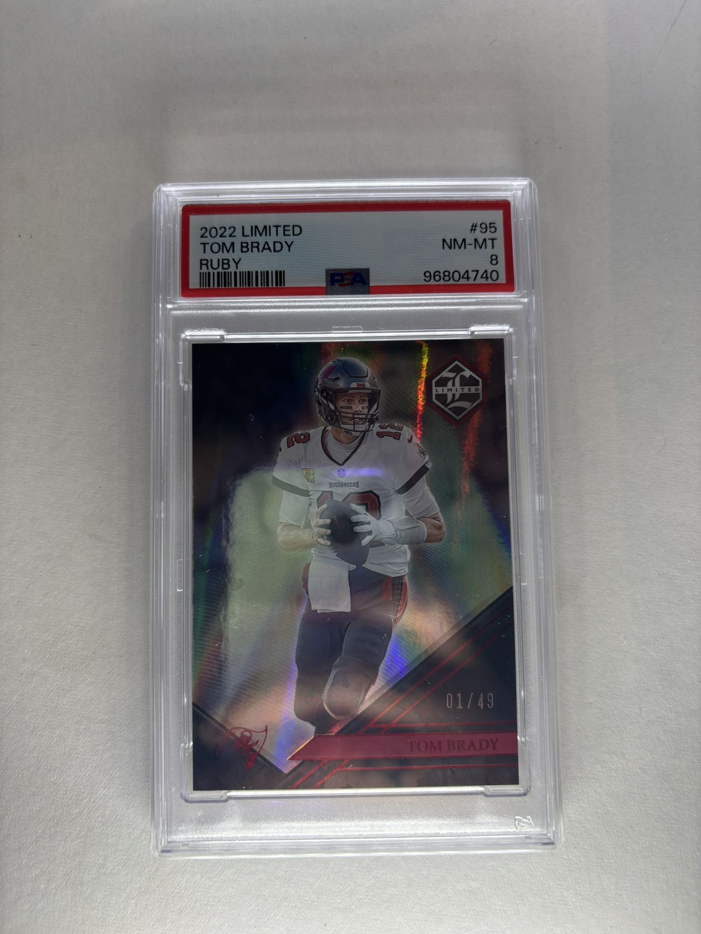PSA 8 - 2022 Panini Limited - Tom Brady #95 Ruby Spotlight /49