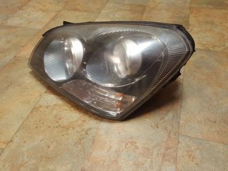 06 KIA OPTIOMO HEAD LIGHT FITS 06 08