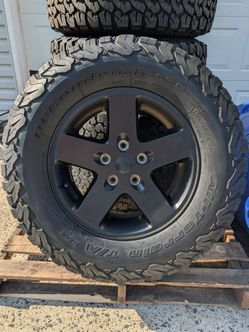 5 Jeep tires and rims