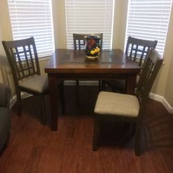 Dining Table 4 Chair.   Excellent condition.  Hardwood and stone material.  