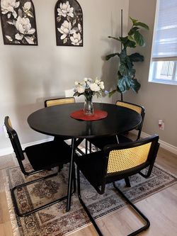Dining table with four rattan chairs