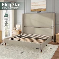 BRAND NEW KING SIZE UPHOLSTERED BED FRAME. STILL IN BOX !