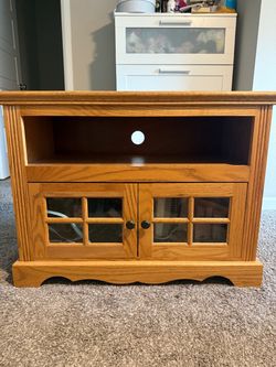 Wood ottoman with glass door cabinet