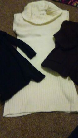 Three sweaters one black sweater,one button up brown sweater,one Cream color dress sweater size large/med.