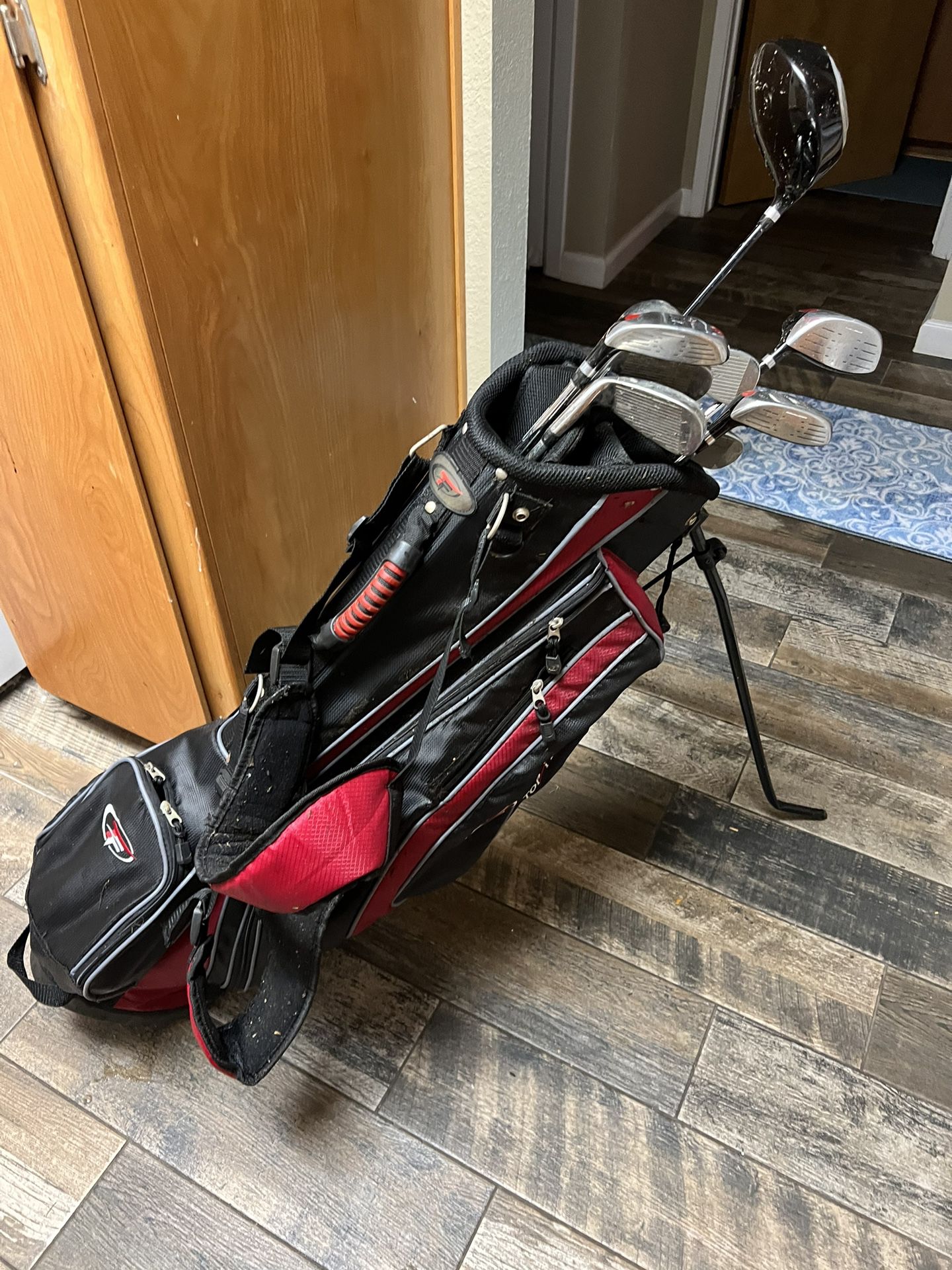 Top flight, golf bag, and clubs.