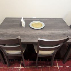 Sleek Dining Table And 4 Chairs In Excellent Condition