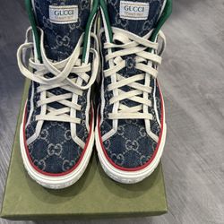 Gucci high top tennis shoe size 10. Like New, comes with box.