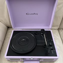 Crosley Cruiser Plus portable Bluetooth record player in a lavender color.