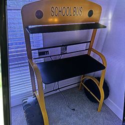 School Bus Desk For Your Kids Includes Power Station For Cell Phones With Two outlets 