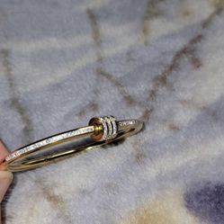 18K gold-filled, stainless steel bangle bracelet with cubic zirconia pavé stones. 
