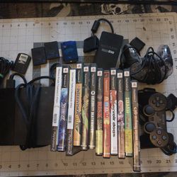 PS 2 Console, 2 Controllers, Mem Cards And Games