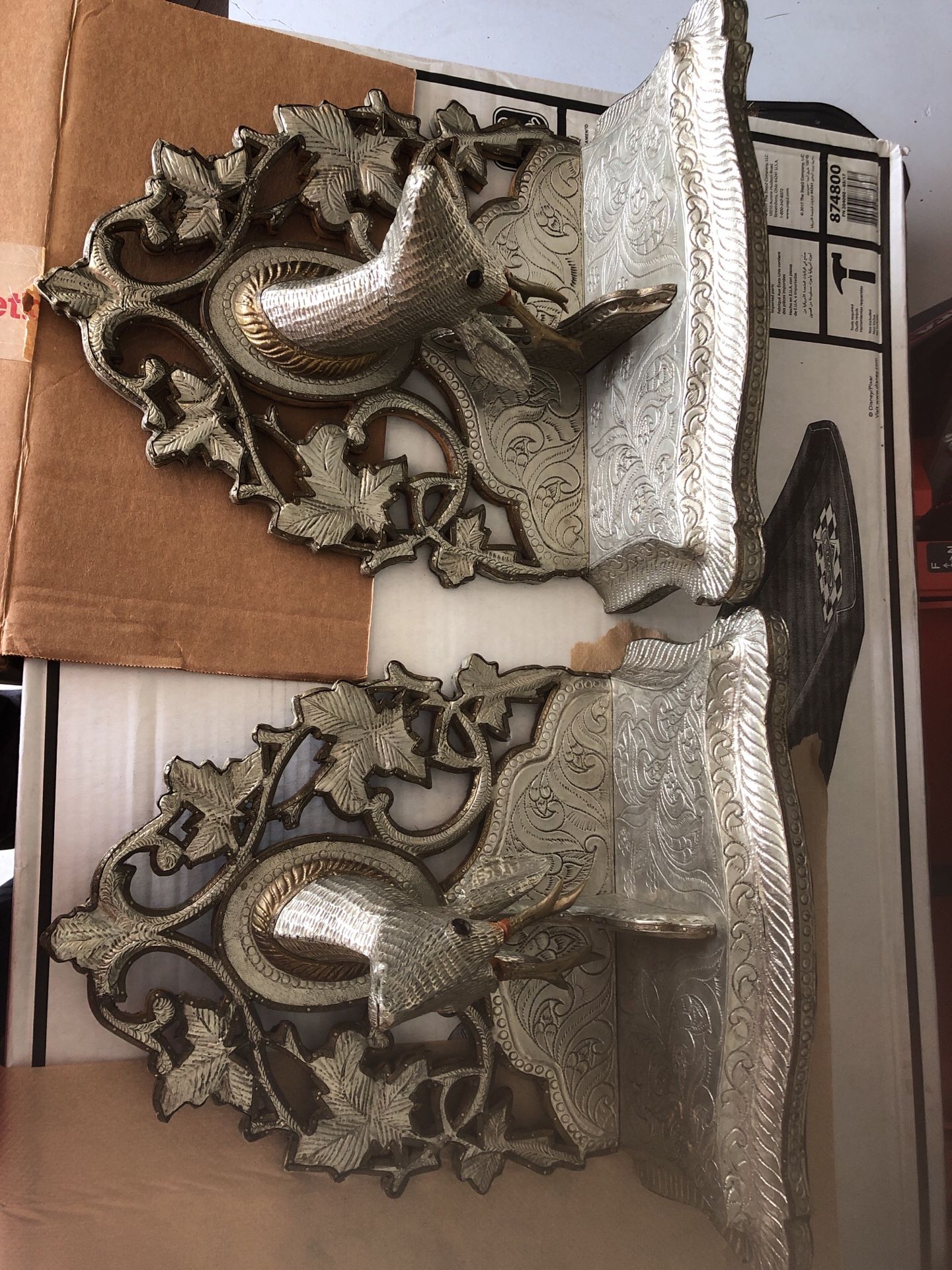 Ornate silver and pewter wall hanging shelves