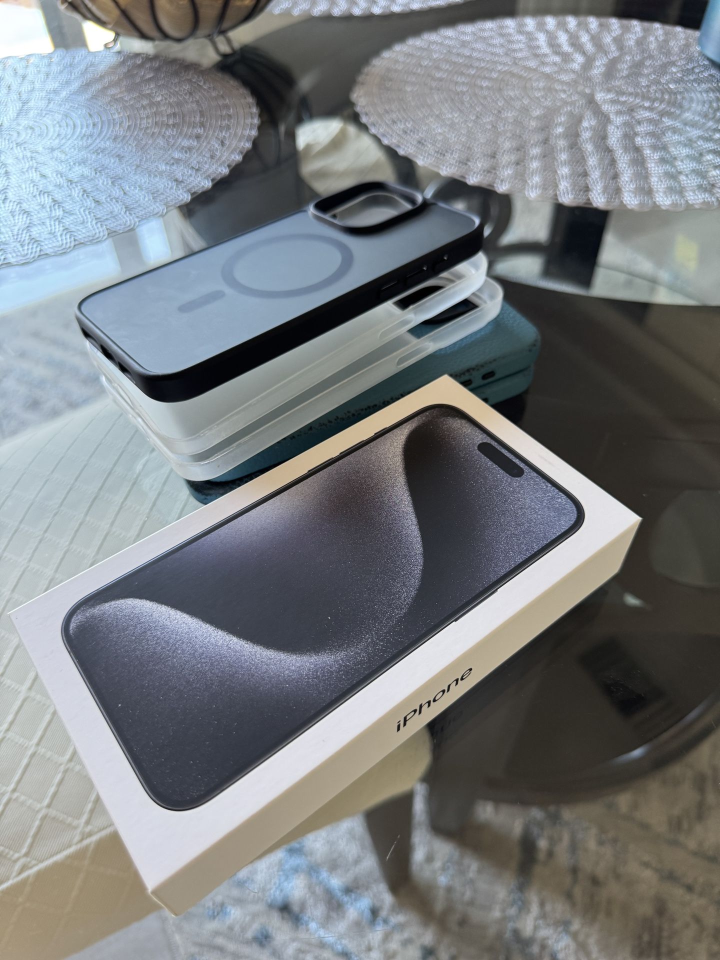 iPhone 15 Pro Max with AirPods