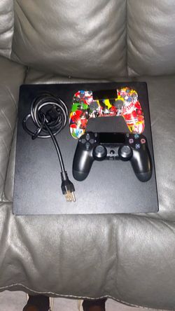 PlayStation 4 Slim Console with Two Controllers