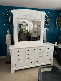 Dresser 65-1/2” long 18” wide and 34” high with mirror in good condition