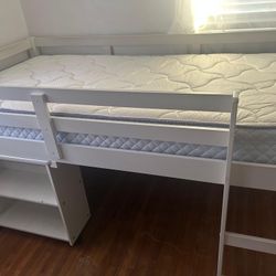 White twin raised Bed With Attached Desk And Bookshelf. Mattress Included. $300