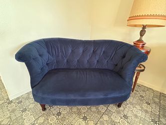 Navy blue velvet loveseat