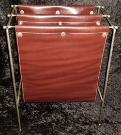 Brown vinyl sling and bent wire ball feet magazine rack record holder Jacques Adnet style firewood log holder

