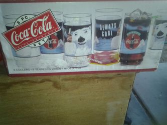 Set of 8 coke glasses collectables