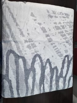 9’x12’ area rug in white and gray