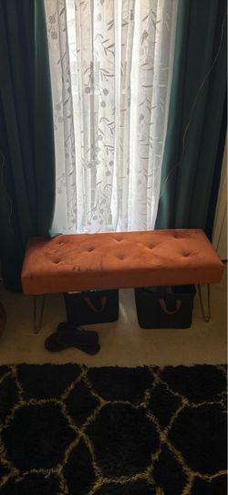 Orange velvet bench