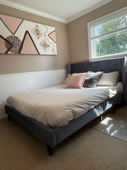 Queen sized bed frame - like new condition - never slept on