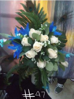 Flowers w/ peacock feathers flower arrangement/bridal bouquet