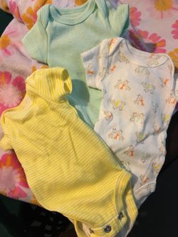 Three brand new premie onsies