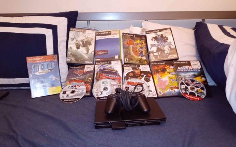 PS2 New with controller and 14Games