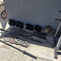 OLYMPIC WEIGHTS WITH BARS AND DUMBBELLS 