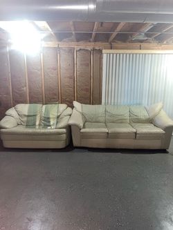 White leather sofa and loveseat