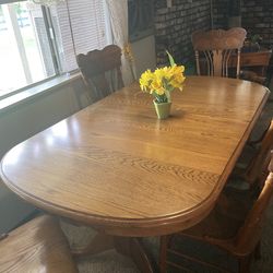 Oak dining table with 6 chairs