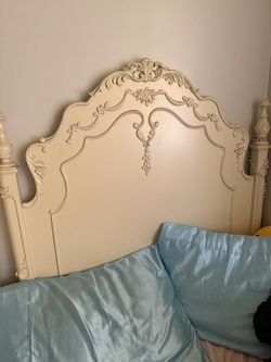 Ornate dress and twin bed