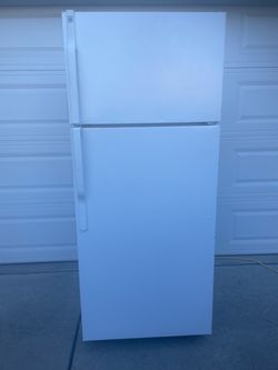 GE top and bottom refrigerator for $180. Dimensions are 28Wx30Dx67H. Pick up only.