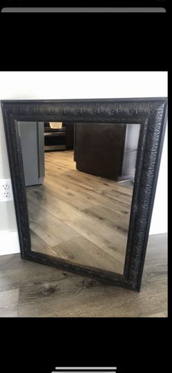 Espresso-colored Hanging Mirror.